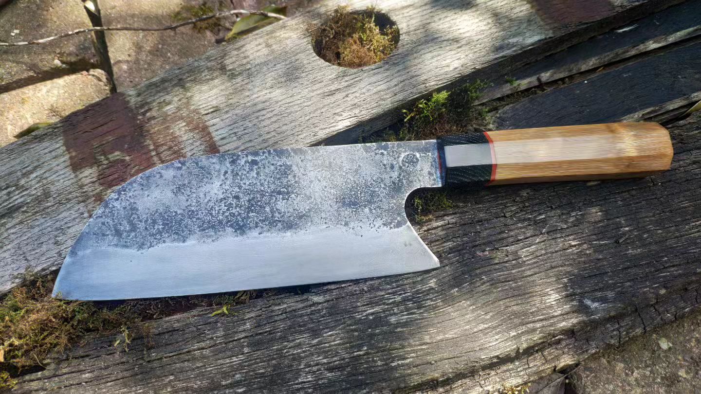 Was gifted this hand crafted chefs knife. 14” Damascus steel with