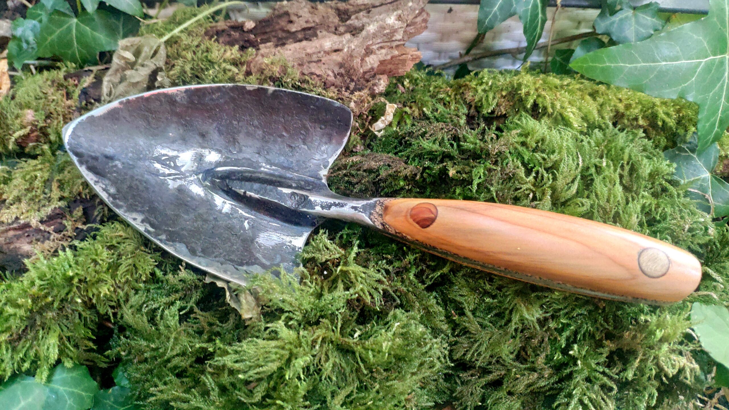 professional hand forged garden trowel with yew handle